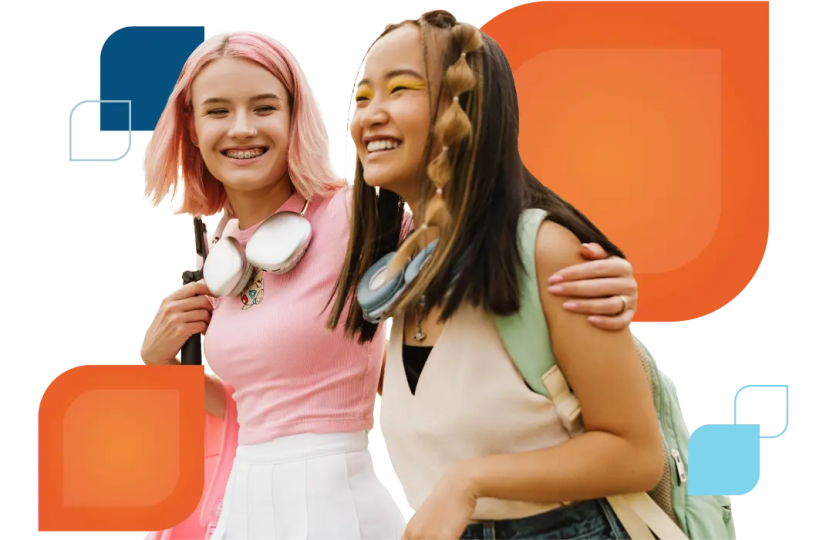 two teens embrace and smile