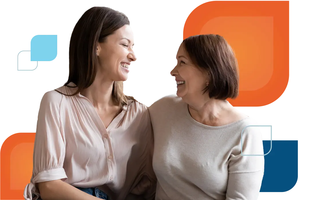 two women smiling at each other