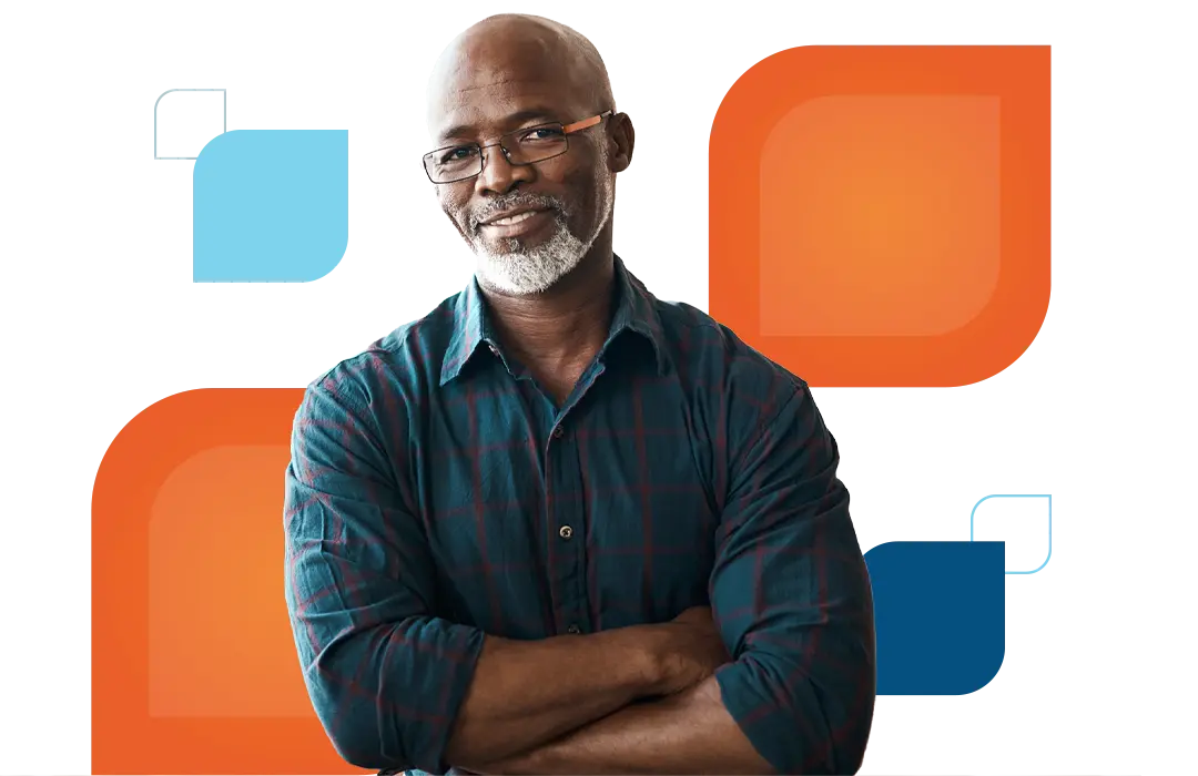 a man crosses his arms and smiles at the camera